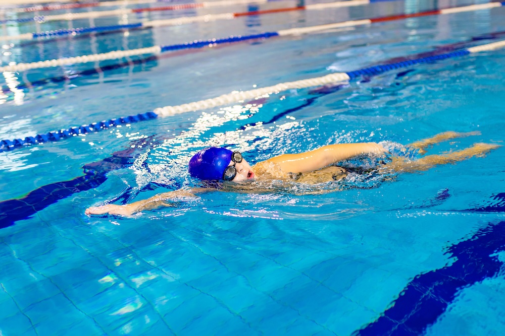 Child swimming laps in a swimming pool